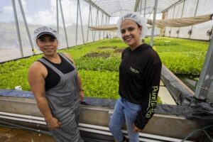 General Manager, Zuleyka Mendoza, and Farm Supervisor, Andrea Baez, in Research Greenhouse