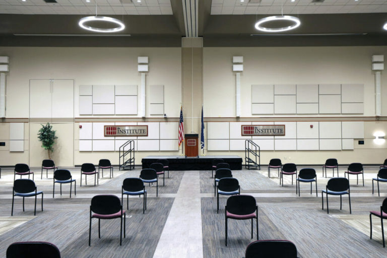 IALR center great hall demonstration photo with empty seats facing a stage